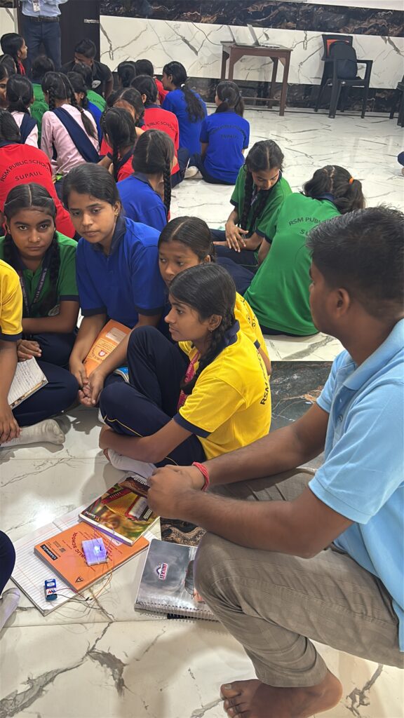 Kids lighting their first LED circuit in a Kod2Kids class